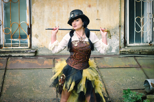 retro portrait of a woman with a cane steampunk style.