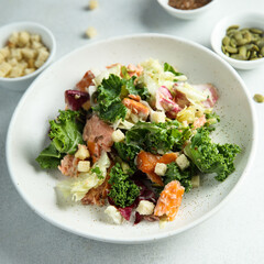 Kale salad with hot smoked salmon