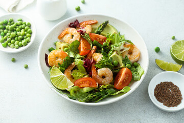 Healthy green salad with shrimps and avocado