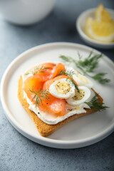 Salmon toast with quail eggs and dill