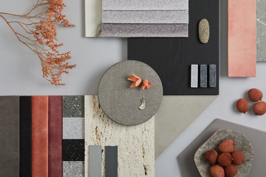 Creative flat lay composition with textile and paint samples, panels and tiles. Stylish interior designer moodboard. Pink, black and light grey color palette. Copy space. Template.