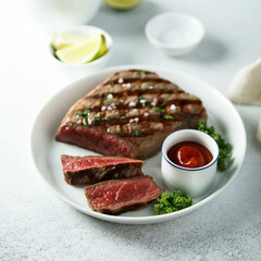 Grilled beef steak with tomato sauce