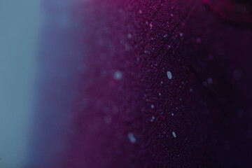Creative colorful dark texture background with blue and purple gradient with paint splash, close-up