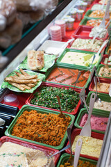 vegetable salads and sides in a market