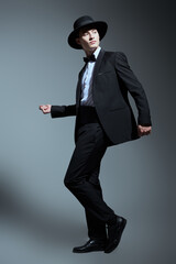 Obraz na płótnie Canvas dude dancing in elegant suit
