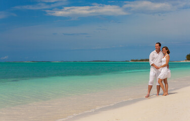 Barefoot Caucasian couple carefree on tropical resort Caribbean