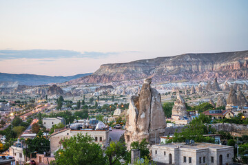 Fototapeta premium Ancient stone dwellings at sunset in Goreme in Cappadocia, Turkey.