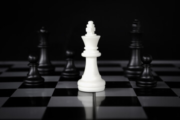 chess game.business leader concept.Selective focus.on a dark background.
