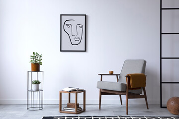 Stylish scandinavian composition of living room with retro design armchair, mock up poster frame, plantstand, decorations and personal accessories in modern home decor. Copy space. Template..