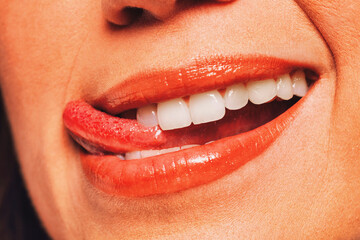 Close up portrait of young sexy woman with red lips and tongue. Youngster face shot in vintage style.