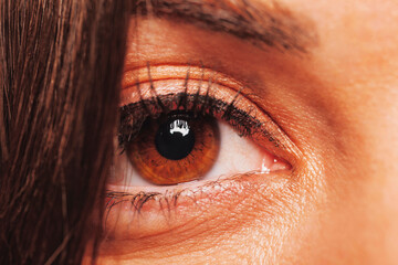 Close-up portrait of beautiful female eye with black liner makeup. Closeup fashion eye.