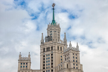 Fototapeta na wymiar Tower of a skyscraper with a star, in the style of the Stalinist Empire