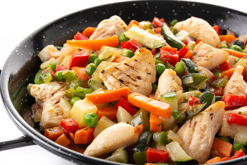 Chicken stir fry and vegetables isolated on white background
