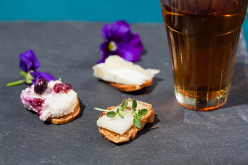 cup of tea with flowers and cheese crackers 