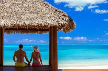Married Couple in tropical hut on beach