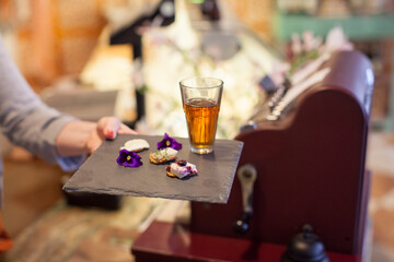 Tea served with cheese crackers and flowers 