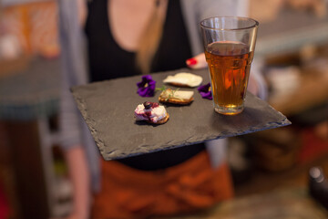 Tea served with cheese crackers and flowers 