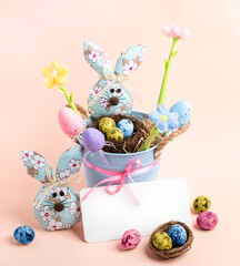Square card with cute Easter children decorations, empty note on pastel pink. Mock up. Copy space.