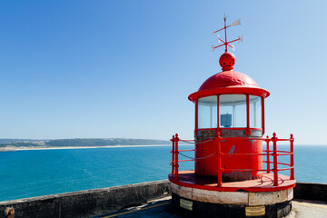 Red lighthouse on the Sao Miguel fort in Nazar&eacute;, Portugal,