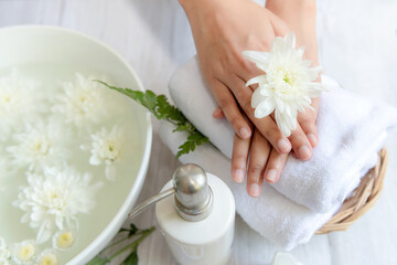 Fototapeta na wymiar Soft and select focus. Spa beauty massage health wellness. Spa Thai therapy treatment aromatherapy for nail and hands woman with white flower nature candle for relax and summer time