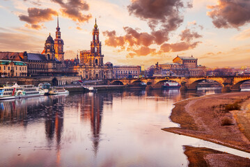 Fototapeta na wymiar Dresden, Germany - Elbe River sunrise with Hofkirche and Bruehl Terrase.