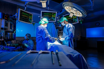 Hospital operating theatre with medical team wearing scrubs - obrazy, fototapety, plakaty