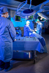 Medical team in theatre wearing personal protective equipment