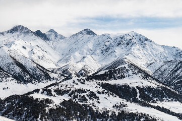 Fototapeta na wymiar Snow-covered peaks of the Kyrgyz Ala-Tau