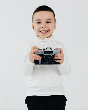 Photo shoot of a cheerful boy in the studio