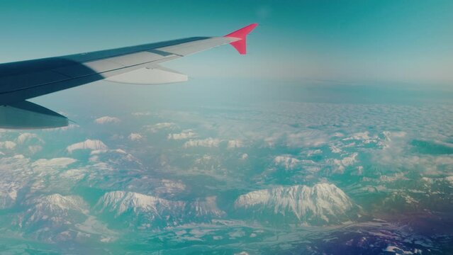 Aircraft cruising over the beautiful Alps of Austria