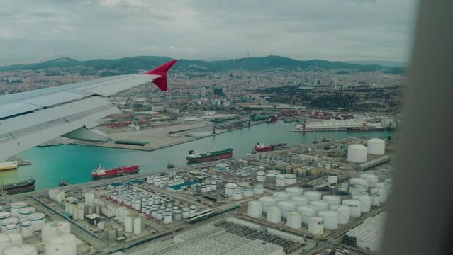 Aircraft approaching Barcelona airport over the harbour