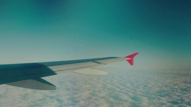 Aircraft cruising over a cloud layer at high altitude