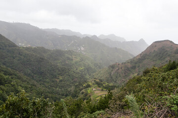 Fototapeta na wymiar Anaga mountains, steep slopes covered with green and lush forest. A Rural Parkand Biosphere Reserve in Tenerife, Canary islands, Spain