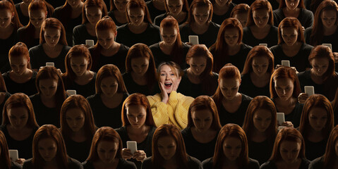 Top view of grey crowd of identical people with gadget, network addiction and special one excited young girl. Difference and diversity concept