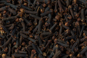 Dried brown pikes of cloves spicy herb, macro top view