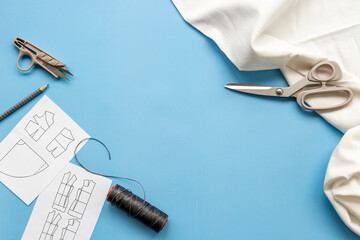 Sewing patterns with fabric - fashion designer table with tailor tools