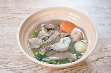 boiled pork entrails and vegetable gourd soup on bowl