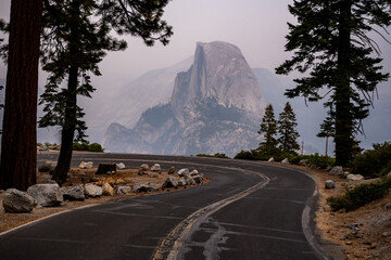 Road Curving Left With Glacier Point In The Distance
