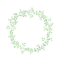 Delicate round frame of green leaves on a white background