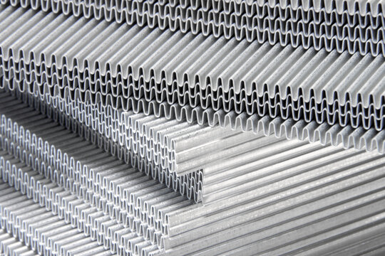 shiny waves of metal. bent aluminum foil. macro photo of corrugation
