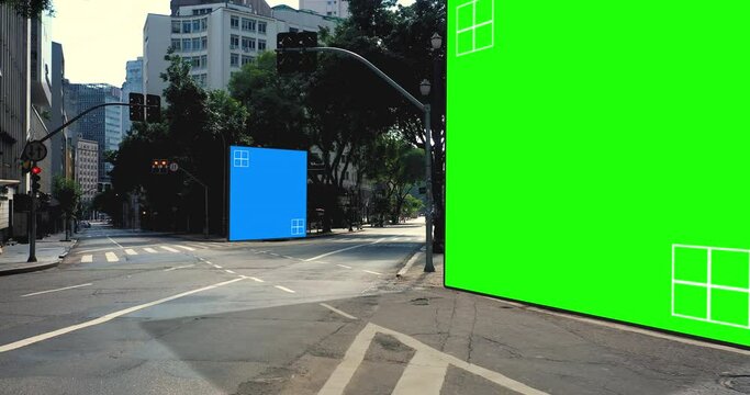 Green and blue screen placeholder billboards on modern city streets - 3D render
