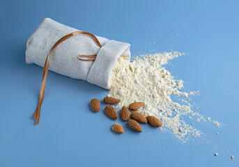 almond flour, bag of nut flour on blue background
