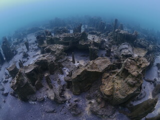 microbialites underwater lake looks like city with towers scuba divers to see