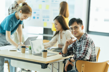 Obraz premium Group of asian young creative happy enjoy laugh smile and great success emotion teamwork people business startup entrepreneur casual brainstorm business meeting office background