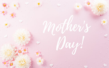 Happy Mother's Day decoration concept made from flowers and the text on pink pastel background.