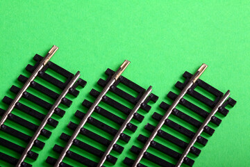 Curved oo gauge model railway track isolated on a green background