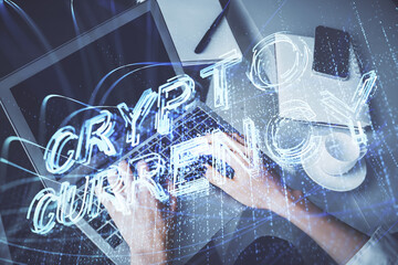 Double exposure of woman hands typing on computer and crypto market theme hologram drawing. Blockchain concept.