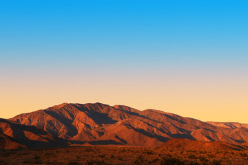 Fototapeta na wymiar sunset evening dusk desert mountain shadows dry aired landscape