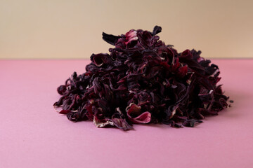 herbal tea, dry hibiskus flower, immune booster in color background © Larisa