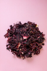 herbal tea, dry hibiskus flower, immune booster in color background © Larisa